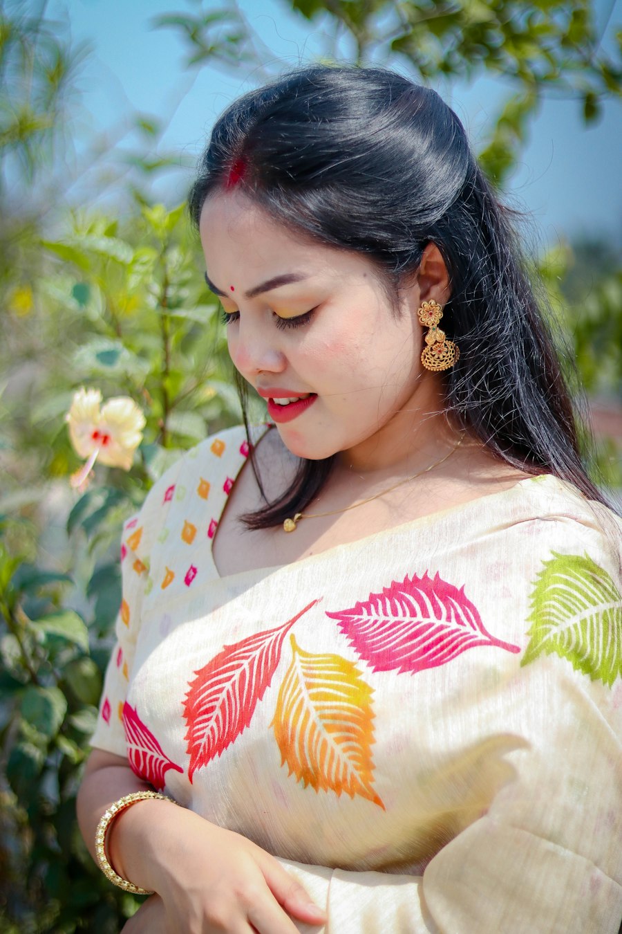 Woman in a leaf print saree